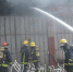 起火店铺大门紧闭。（消防供图） - Meizhou.Cn