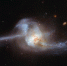 哈勃望远镜捕捉到两个星系合并形成的“宇宙结”。图片源：NASA/ESA - News.Ycwb.Com