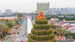 年桔塔是由1138盆年桔树组成的16层桔塔，高达16.8米。顺德区委宣传部 供图 - 中国新闻社广东分社主办